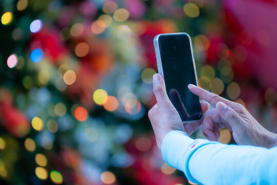 Close-up male hand using smartphone. Searching data networks and typing sending message.