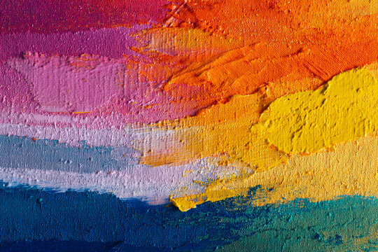 Abstract painting featuring bold brushstrokes of vibrant pink purple orange yellow and blue hues on a textured canvas,