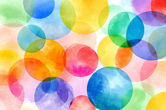 A vibrant watercolor painting of overlapping circles in a rainbow of colors fills the frame creating a joyful and abstract pattern