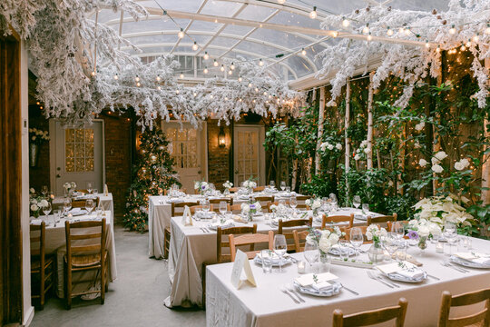 Elegant winter dining setup in a cozy restaurant with festive decorations