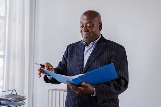 Senior man business accountant Documents data contract partner deal in workplace office.
