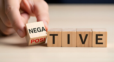 Choosing positive attitude overcoming negativity hand flipping wooden cube with words positive and negative representing optimism resilience mental strength mindset success