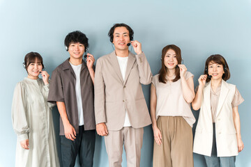 Fototapeta premium Call center, intercom working at customer center, male and female operator staff wearing headsets 