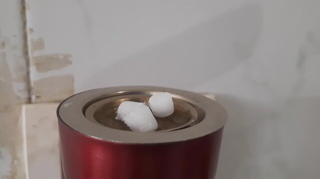 Camphor balls vaporizing in time-lapse 