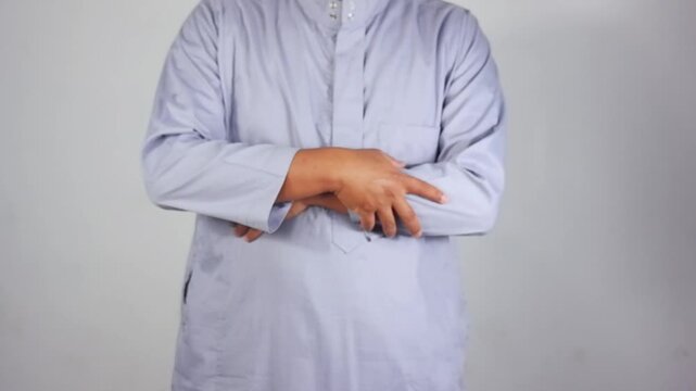 The takbir gesture during prayer. The palms are raised to shoulder level or ear level. A movement in prayer, a Muslim's act of worship
