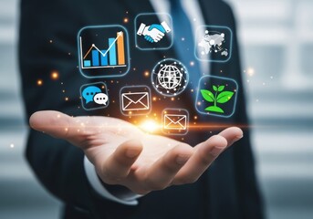 Businessman holding holographic icons representing technology, data, and digital communication concepts