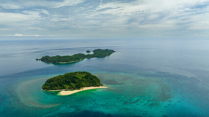 Aerial drone of tropical islands with beach and blue sea. Agutaya and Danjugan islands, Philippines. © Alex Traveler