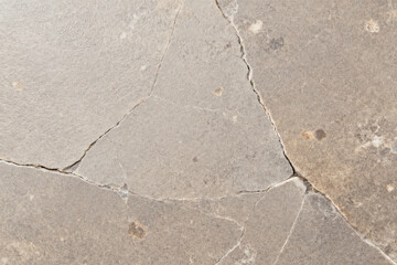 Fototapeta premium Weathered Concrete Surface, Cracked Pavement, Urban Texture, Rough Road, Stone Pattern, Outdoor Ground