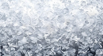 Captivating close-up of intricate icy patterns covering a cold winter surface, showcasing the delicate beauty of natural frost formations on a windowpane with shimmering crystal details