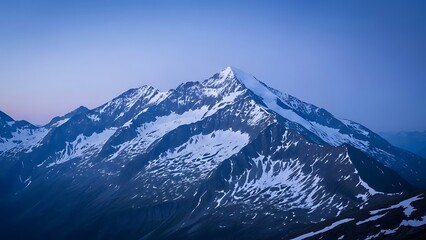 Majestic snow-capped alpine peaks under a serene twilight sky, capturing the breathtaking grandeur and rugged beauty of a high-altitude mountain landscape