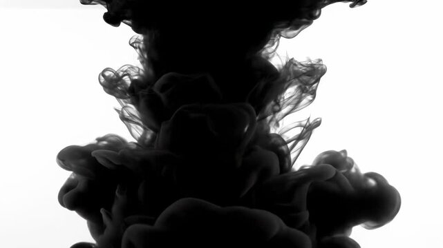 Ink in water abstract: An abstract display of black ink dissolving in water, creating a mesmerizing cloud-like formation. Capturing the beautiful, unpredictable dance of liquid