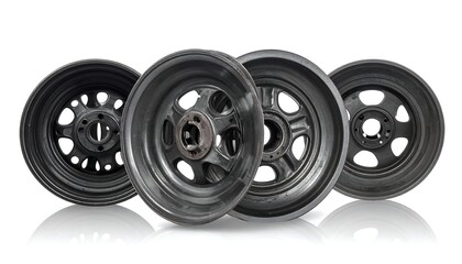 Four black wheels with a classic design, slightly reflected, isolated on white