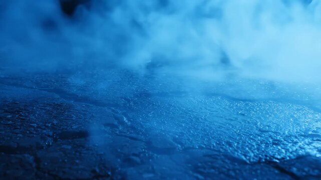 Nighttime drift scene shows cool blue smoke billowing across cracked asphalt for action film car racing automotive commercial