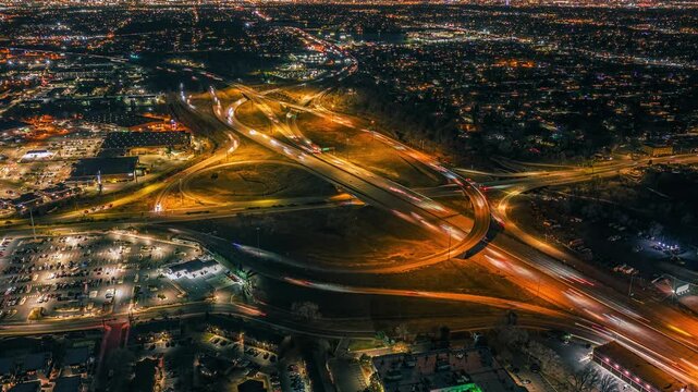 High-speed highway intersection at night, aerial hyperlapse, fast, Denver, Colorado