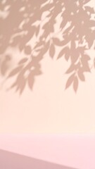 Dappled leaf light and pink shadow on cream plaster wall