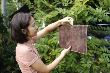 Woman doing laundry in the morning.