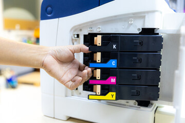 Technician Holding ink printer toner low for replace new or fix repair problem paper or print...