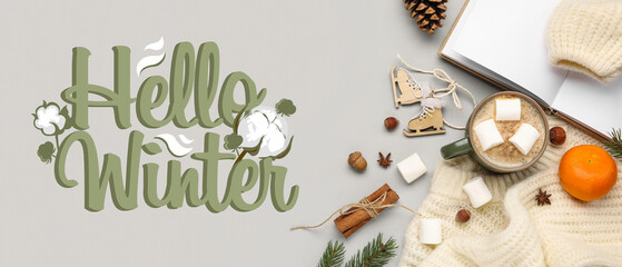 Naklejka premium Cup of cocoa drink, notebook and sweater with text HELLO WINTER on grey background