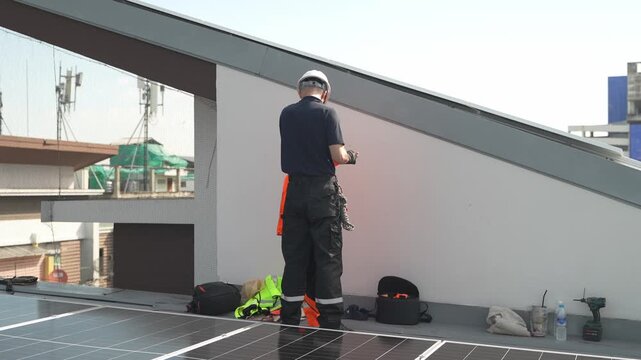 Professional who installs solar energy systems,  procuring equipment, and performing the physical installation of solar panels on roofs. 