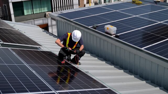 Professional who installs solar energy systems,  procuring equipment, and performing the physical installation of solar panels on roofs. 