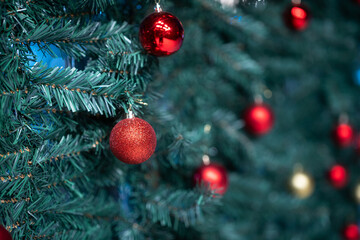 Merry x-mas,Close up of Colorful balls ,gifts box and Christmas greeting picture parcel,bell decoration on Green Christmas tree background Decoration During Christmas and New Year.