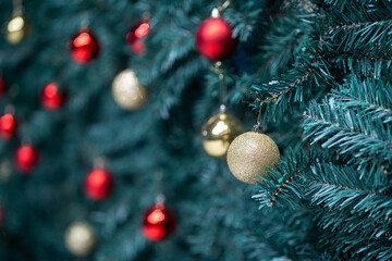 Merry x-mas,Close up of Colorful balls ,gifts box and Christmas greeting picture parcel,bell decoration on Green Christmas tree background Decoration During Christmas and New Year.