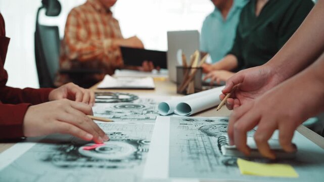 A diverse group of professionals engages in a lively brainstorming session focused on design and planning. The atmosphere is collaborative and innovative. SACTR