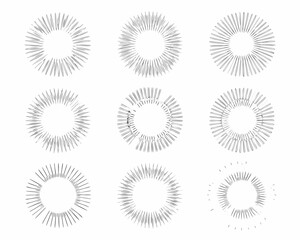 Collection of nine hand drawn circular starburst elements on white background