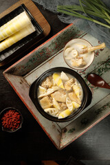 Asian Chicken Soup with Bamboo Shoots Spring Recipe Traditional Bowl Wooden Tray Chopsticks