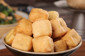 Deep Fried Tofu Puffs - Golden Crispy Bean Curd Dishes in Wooden Bowl