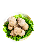 Hot Asian Meat Balls with Lettuce Garnish in White Bowl - Traditional Delicacies with Beef and Potato Ingredients