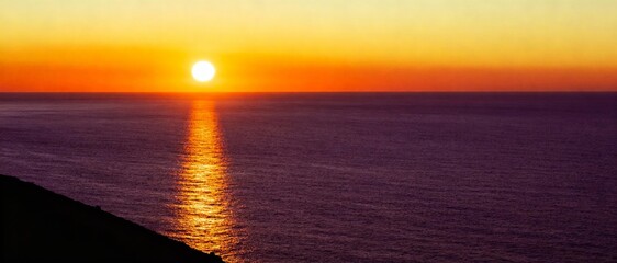 tranquil sea sunset panorama with warm orange sky and shimmering water