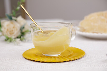 Fresh Ginger Tea with Honey in Glass Cup on Yellow Plate - Healthy Herbal Drink