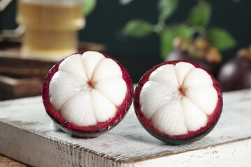 Fresh Mangosteen Fruit Halves Showing White Flesh - Traditional Thailand Tropical Fruit