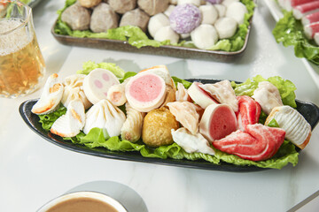 Assorted Hotpot Ingredients with Meatballs, Beef and Seafood for Asian Hot Pot Cooking