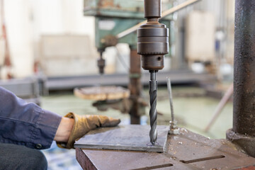 Metal drilling on industrial drill press