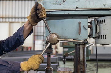 Metal drilling on industrial drill press