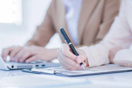 Business people discussing the charts and graphs showing the results of their successful teamwork