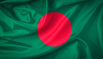 Bangladeshi flag with red circle offset left on green field, shown with fabric texture and gentle motion.
