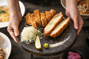 Delicious Cheese Katsu and Tonkatsu Platter Served with Cabbage and Lemon
