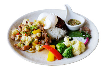 Stir-fried pork with cauliflower with boiled egg, fish sauce, broccoli and raspberry rice on a white plate