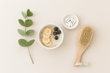 Healthy breakfast bowl with fruit and body brush for wellness
