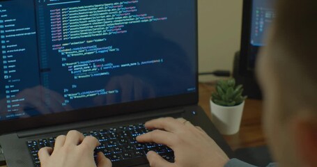 software developer writing line of source code in personal laptop - Powered by Adobe