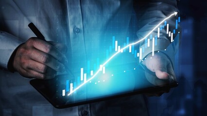 A business professional analyzes financial growth using a digital tablet. The graph illustrates an upward trend, symbolizing success and innovation in finance. Copula