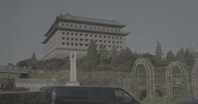 Traditional architectural features amidst urban landscape. Beijing Ming City Wall Ruins Park.