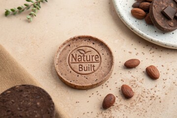 Close up of a cocoa disc with Nature Built logo