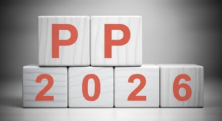 Wooden blocks spelling out pp 2026 stacked in a pyramid shape against a dark, vignetted background for a business concept Background image