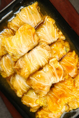 Golden Cabbage Rolls with Sauce - Chinese Cuisine Delicacy