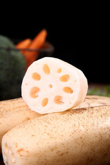 Fresh Lotus Root Cross Section with Roots and Carrots