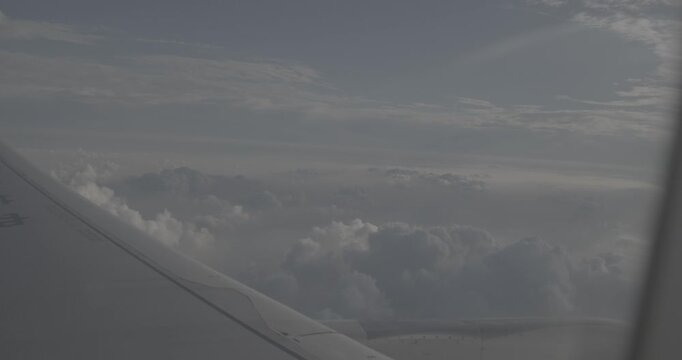Vibrant clouds and sunlight views from an airplane wing